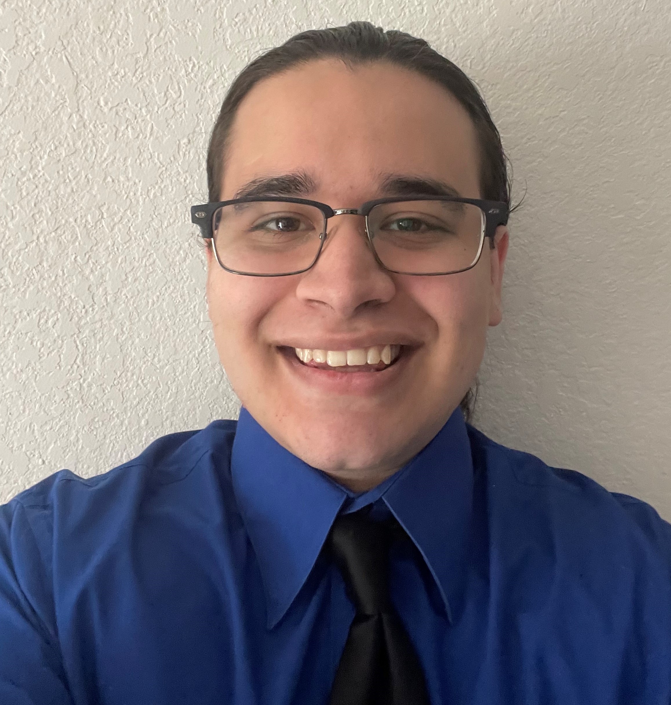 Joseph, a university student smiling